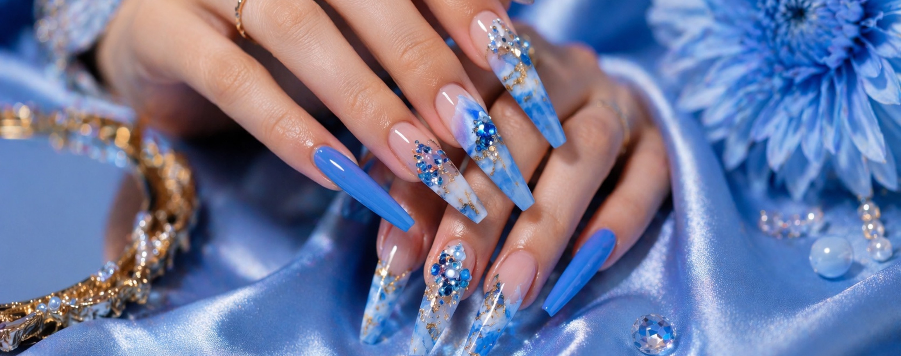Detailed blue and crystal nail design